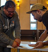 photo of two people cooperating